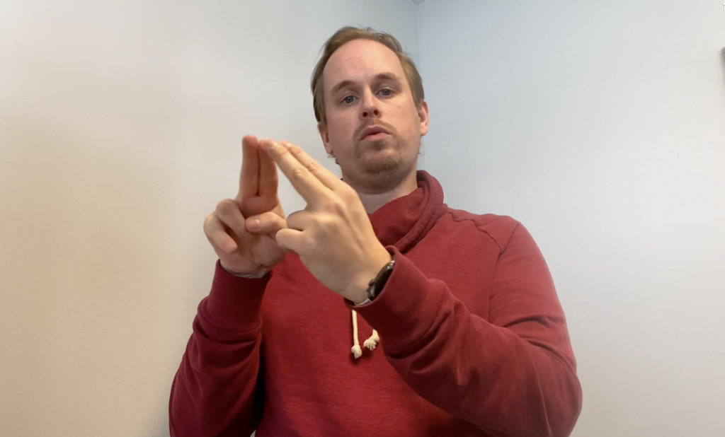 Tobias tecknar ordet kontakt.